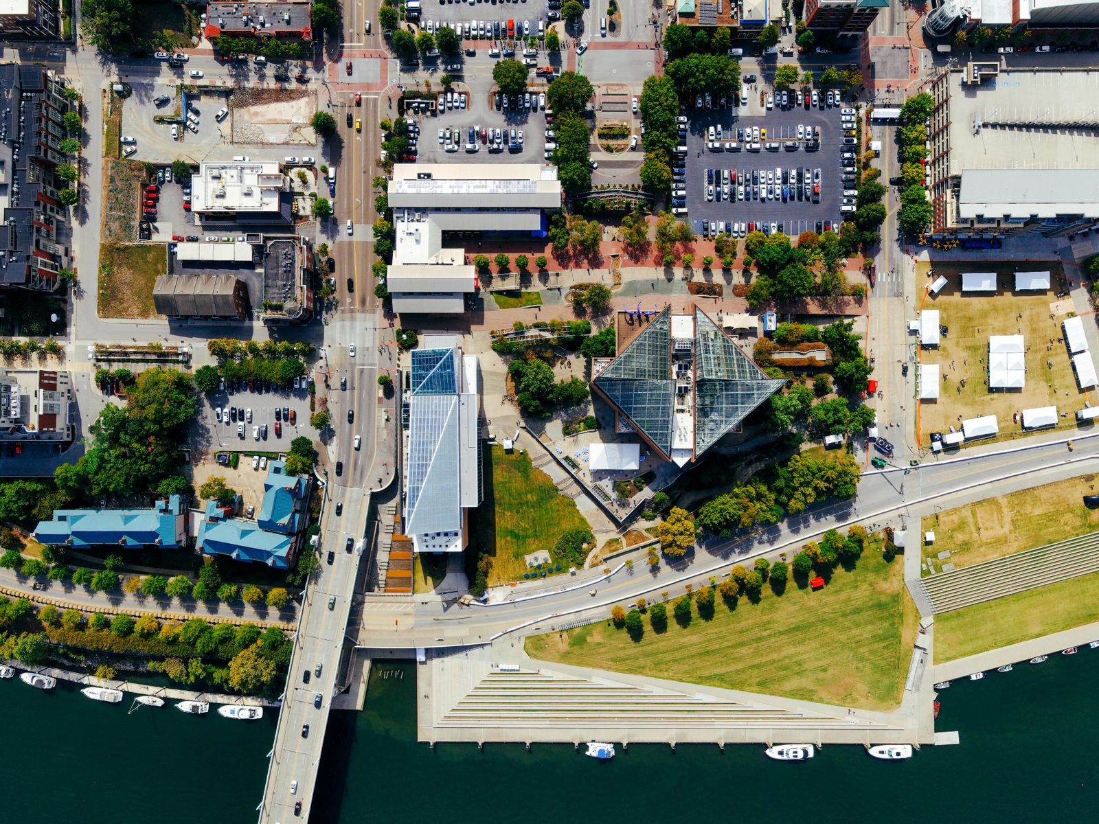 Aerial photograph showcasing modern urban architecture and parking spaces in a vibrant cityscape.